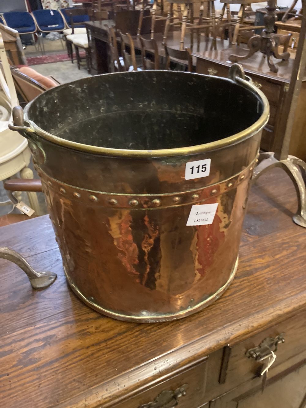 A Victorian copper and brass circular coal bucket, diameter 34cm, together with a pair of brass and wrought iron andirons